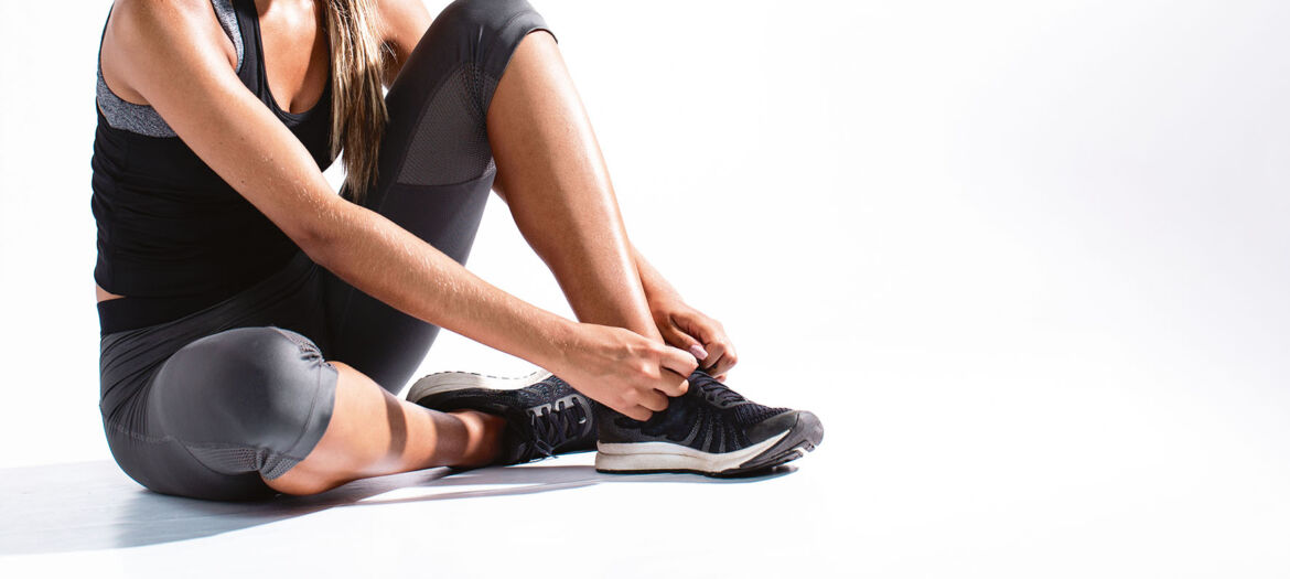 close-up-girl-tying-her-shoelaces